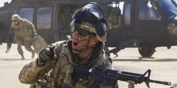 Sergeant 1st Class Aaron Sanford, a maintenance supervisor, Delta Battery, 1st Battalion, 145th Field Artillery Regiment, gives commands to his platoon following their departure from a UH-60 Black Hawk near Camp Buehring, Kuwait, Feb. 28, 2018. (U.S. Army photo by Spc. Joshua P. Morris, USARCENT PAO)