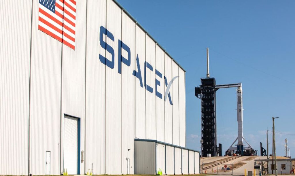 A SpaceX Falcon 9 rocket, with the Crew Dragon atop, stands poised for launch at historic Launch Complex 39A at NASA’s Kennedy Space Center in Florida on May 21, 2020, ahead of NASA’s SpaceX Demo-2 mission. Photo credit: NASA/Kim Shiflett